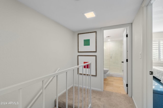 4620 N 68th St Unit 136, Scottsdale, AZ 85251 - corridor with light carpet, an upstairs landing, and baseboards