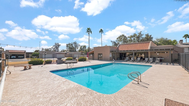 view of swimming pool with a patio