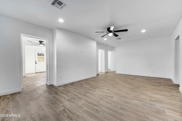 spare room with light hardwood / wood-style flooring and ceiling fan