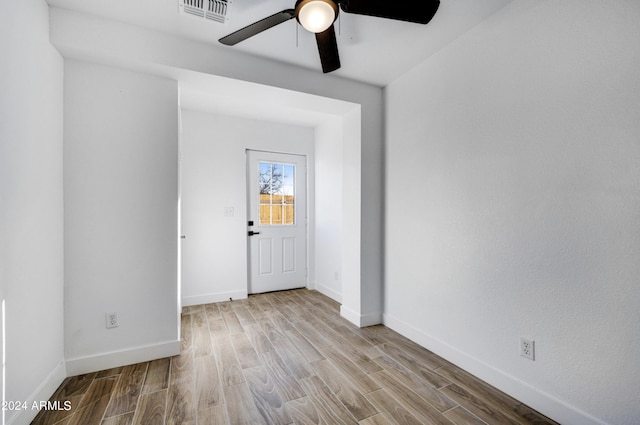 unfurnished room featuring ceiling fan and light hardwood / wood-style flooring