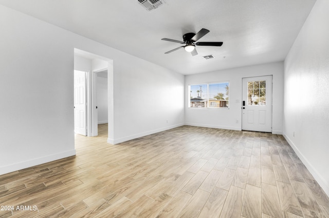 unfurnished room with ceiling fan and light hardwood / wood-style floors