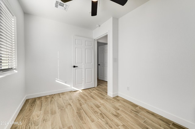 unfurnished bedroom featuring light hardwood / wood-style floors and ceiling fan