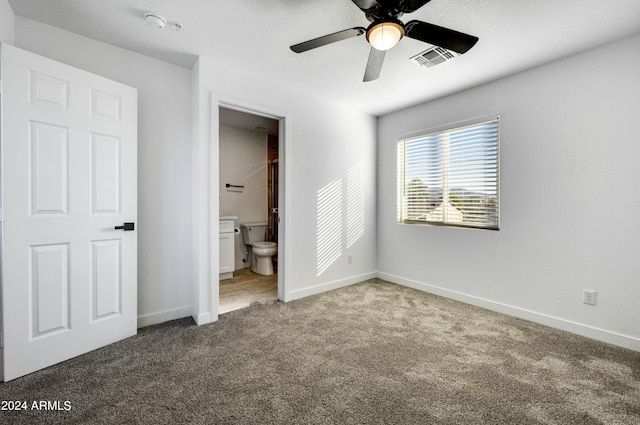 unfurnished bedroom featuring a textured ceiling, carpet floors, ceiling fan, and connected bathroom