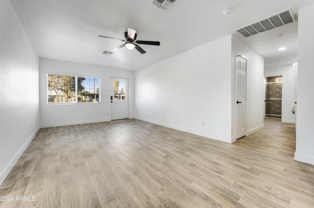 unfurnished room featuring ceiling fan and light hardwood / wood-style flooring