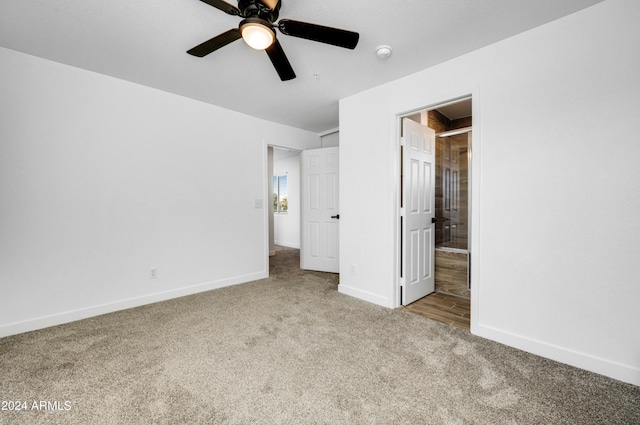 unfurnished bedroom with ceiling fan and light colored carpet