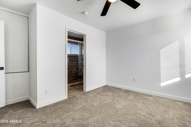 unfurnished bedroom featuring carpet flooring, a closet, and ceiling fan