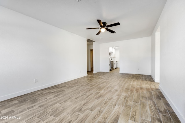 unfurnished living room with ceiling fan and light wood-type flooring