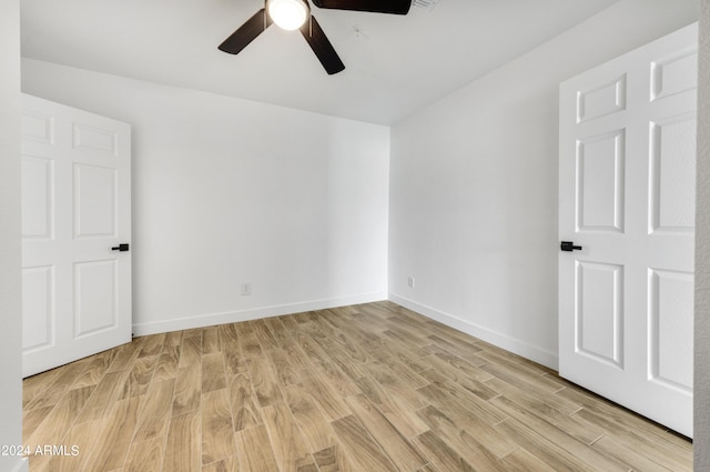 spare room with ceiling fan and light hardwood / wood-style floors