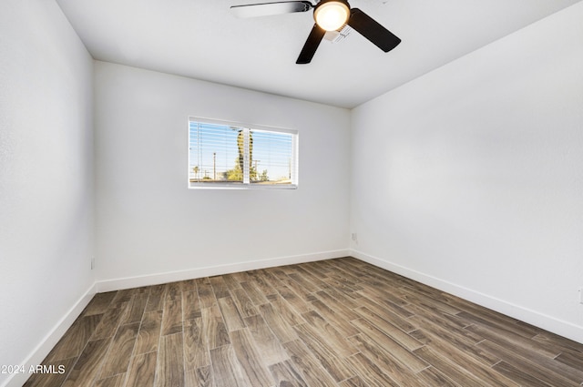 empty room with hardwood / wood-style flooring and ceiling fan