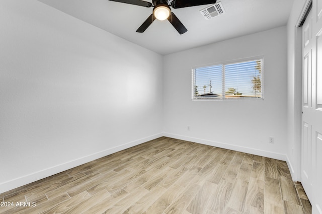 unfurnished room featuring ceiling fan and light hardwood / wood-style floors