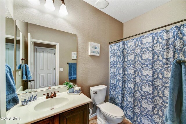 31133 N 132nd Ln, Peoria, AZ 85383 - bathroom featuring a textured wall, vanity, and a shower with shower curtain