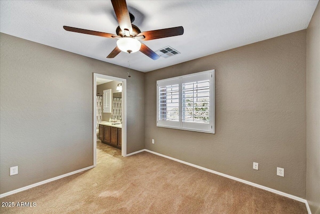 31133 N 132nd Ln, Peoria, AZ 85383 - spare room with a ceiling fan and light colored carpet