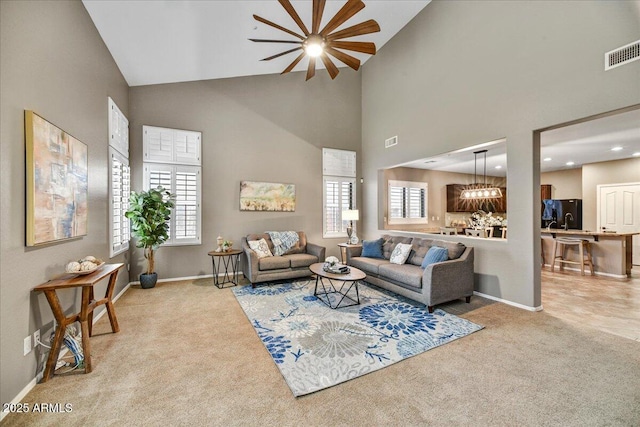 31133 N 132nd Ln, Peoria, AZ 85383 - living area featuring carpet floors, high vaulted ceiling, and a ceiling fan