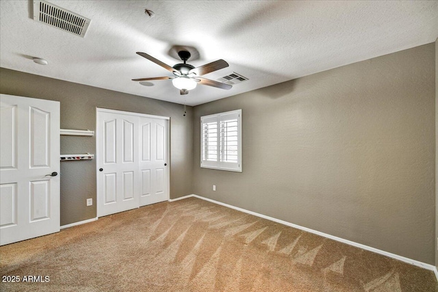 31133 N 132nd Ln, Peoria, AZ 85383 - unfurnished bedroom with carpet, a closet, ceiling fan, and a textured ceiling