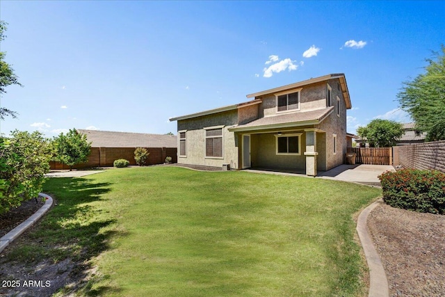 31133 N 132nd Ln, Peoria, AZ 85383 - back of house featuring a fenced backyard, a patio area, and stucco siding
