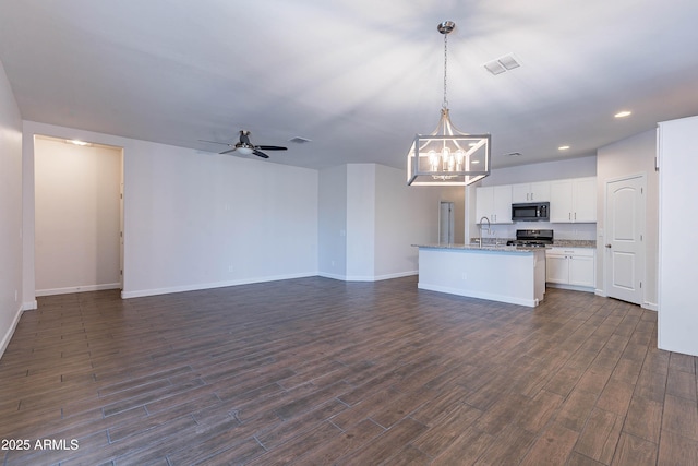 13523 W Remuda Dr, Peoria, AZ 85383 - kitchen featuring stainless steel appliances, open floor plan, a chandelier, ceiling fan, and white cabinets