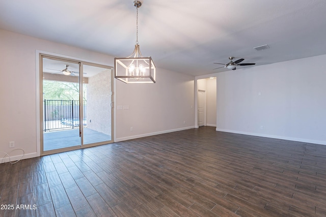 13523 W Remuda Dr, Peoria, AZ 85383 - spare room featuring ceiling fan, dark wood finished floors, and baseboards
