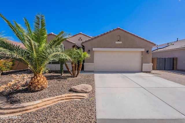 13523 W Remuda Dr, Peoria, AZ 85383 - view of front facade with driveway, an attached garage, stucco siding, and a tile roof