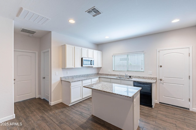 13523 W Remuda Dr, Peoria, AZ 85383 - kitchen with dishwasher, stainless steel microwave, dark wood-type flooring, white cabinets, and recessed lighting