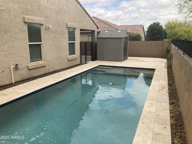 13523 W Remuda Dr, Peoria, AZ 85383 - view of swimming pool with a storage unit, an outdoor structure, and a fenced backyard