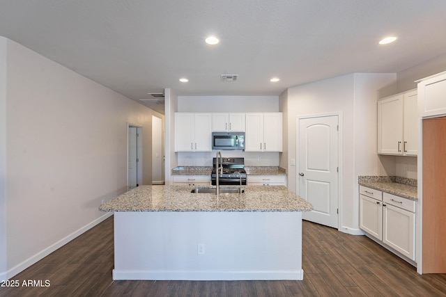 13523 W Remuda Dr, Peoria, AZ 85383 - kitchen with black gas range oven, recessed lighting, a sink, dark wood-style floors, and light stone counters