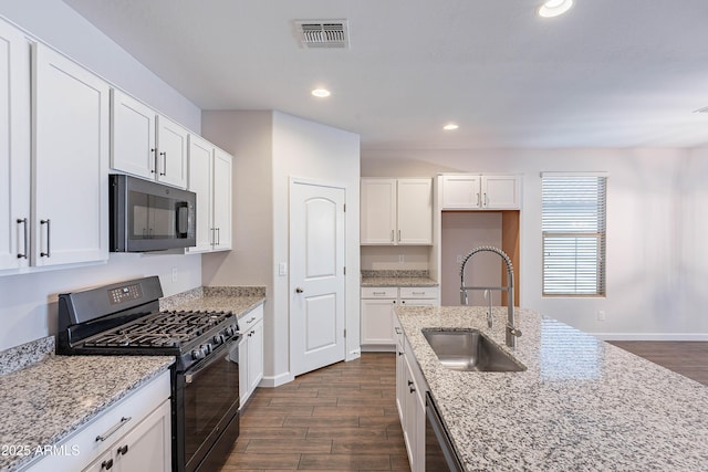 13523 W Remuda Dr, Peoria, AZ 85383 - kitchen featuring black appliances, a sink, dark wood-type flooring, baseboards, and recessed lighting