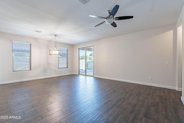 13523 W Remuda Dr, Peoria, AZ 85383 - unfurnished room with dark wood-style flooring, a ceiling fan, and baseboards