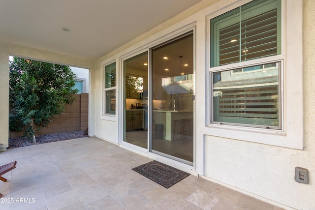 property entrance with a patio area