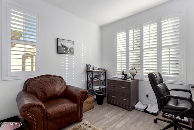 office space with light wood-type flooring