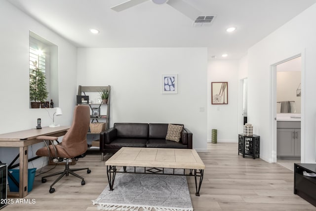 office with light hardwood / wood-style flooring