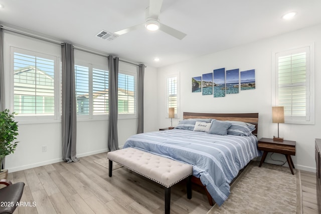 bedroom featuring light hardwood / wood-style flooring and ceiling fan