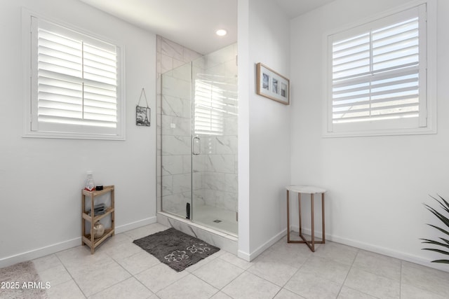 bathroom with tile patterned floors and an enclosed shower