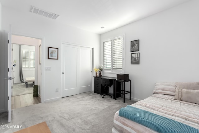 bedroom with carpet flooring and a closet