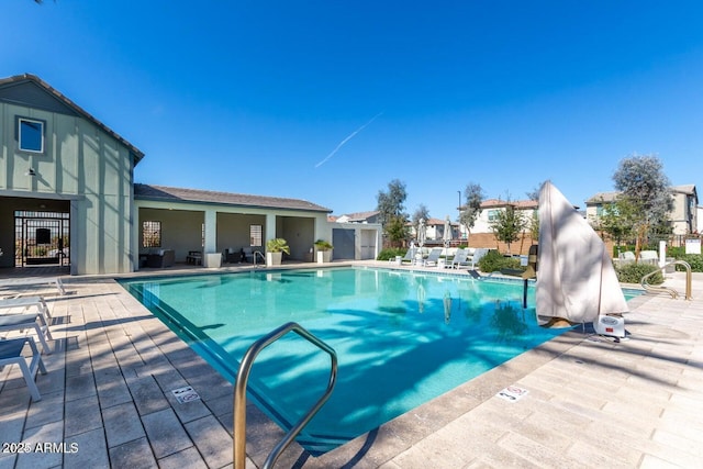 view of swimming pool with a patio area