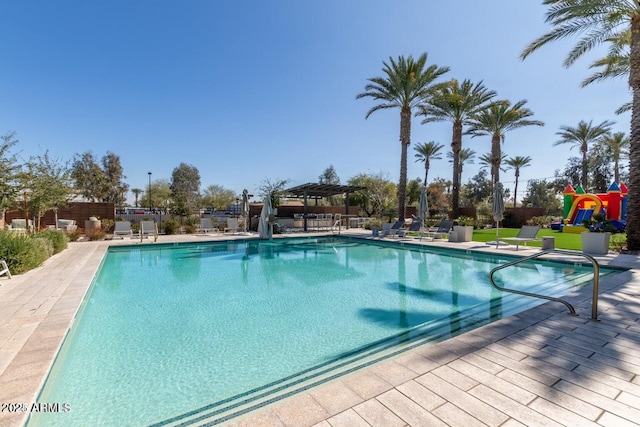 view of swimming pool featuring a patio area and a pergola