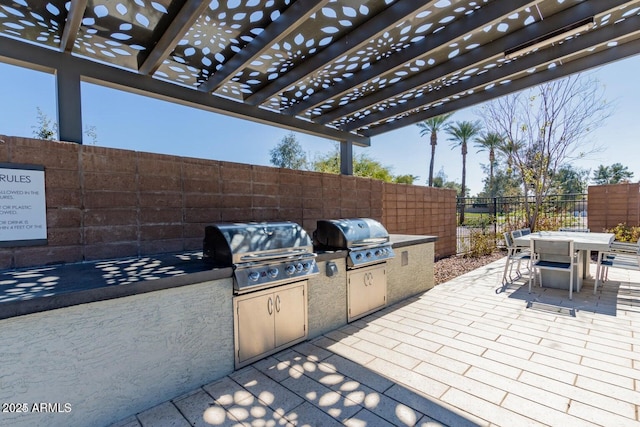 view of patio featuring a pergola and area for grilling