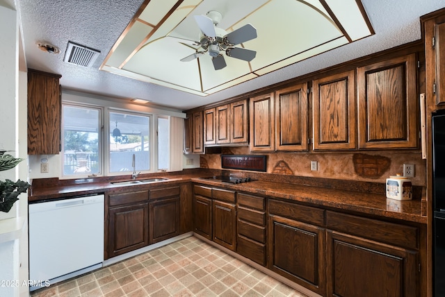 365 Leisure World, Mesa, AZ 85206 - kitchen with white dishwasher, dark countertops, black electric cooktop, ceiling fan, and a textured ceiling