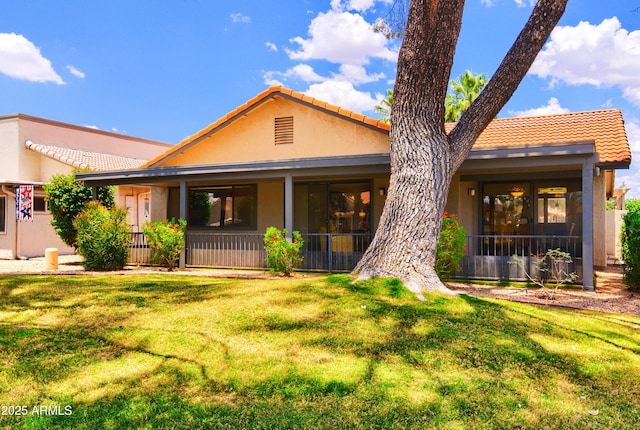 365 Leisure World, Mesa, AZ 85206 - back of house with a tiled roof, stucco siding, and a lawn
