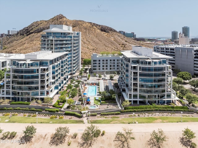bird's eye view of a mountainous background and a pool