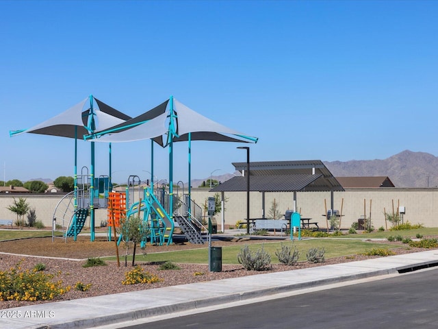 view of playground with a mountain view