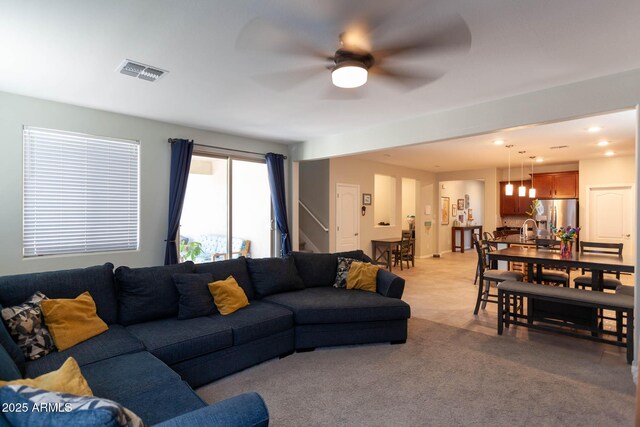 19937 W Heatherbrae Dr, Litchfield Park, AZ 85340 - living area with ceiling fan, stairs, light colored carpet, and recessed lighting