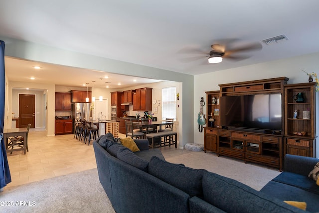 19937 W Heatherbrae Dr, Litchfield Park, AZ 85340 - living area with ceiling fan, recessed lighting, and light carpet