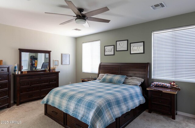 19937 W Heatherbrae Dr, Litchfield Park, AZ 85340 - bedroom with light carpet, a ceiling fan, and baseboards