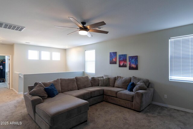 19937 W Heatherbrae Dr, Litchfield Park, AZ 85340 - living area with light colored carpet, a ceiling fan, and baseboards