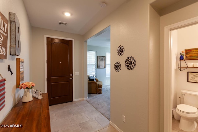 19937 W Heatherbrae Dr, Litchfield Park, AZ 85340 - hall with light tile patterned floors and baseboards
