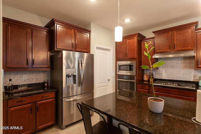 19937 W Heatherbrae Dr, Litchfield Park, AZ 85340 - kitchen featuring appliances with stainless steel finishes, under cabinet range hood, backsplash, decorative light fixtures, and recessed lighting