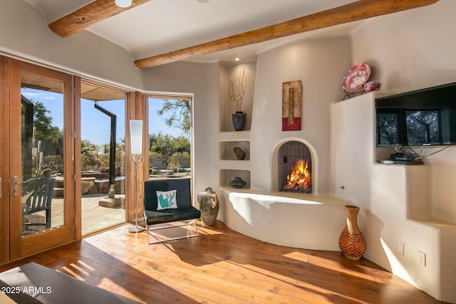 interior space featuring hardwood / wood-style flooring and beam ceiling