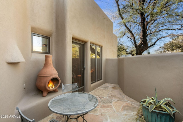 view of patio / terrace featuring a fireplace