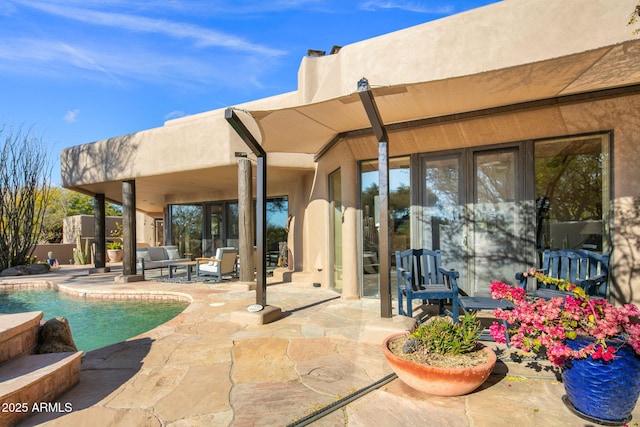 rear view of house featuring a patio