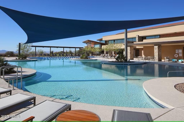 view of swimming pool with a patio